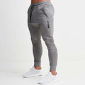 Gray jogger pants with a brand logo on a white background