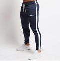 Navy jogger pants with white stripes and 'GENT' branding on a white background