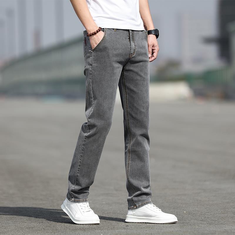 Man wearing smoky gray straight leg jeans with stretch comfort
