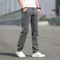 Man wearing smoky gray straight leg jeans with stretch comfort
