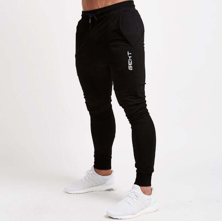 Black jogger pants with a brand logo on a white background