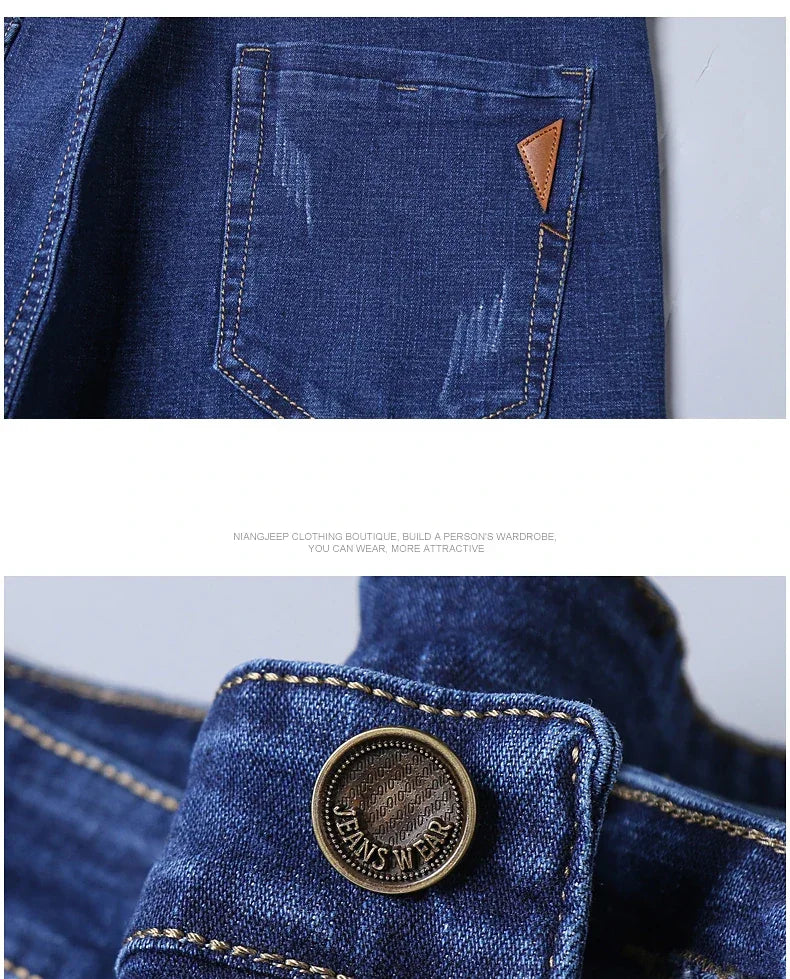 Close-up of blue denim fabric with stitching and button detail on a light gray background.