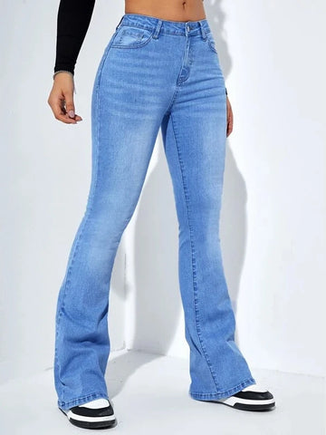 Woman wearing high-waist blue flared jeans with stretch denim, styled for casual wear on a white background
