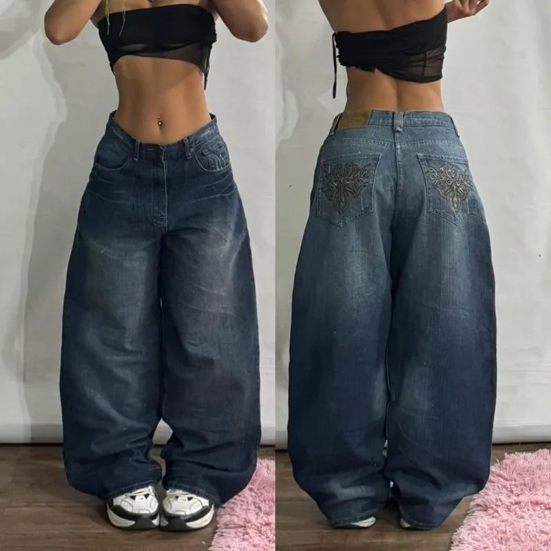 Pair of women’s wide-leg jeans shown from front and back, high-waist denim with a relaxed fit on a neutral background