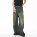 Man wearing men's wide-leg loose straight fit jeans on white background
