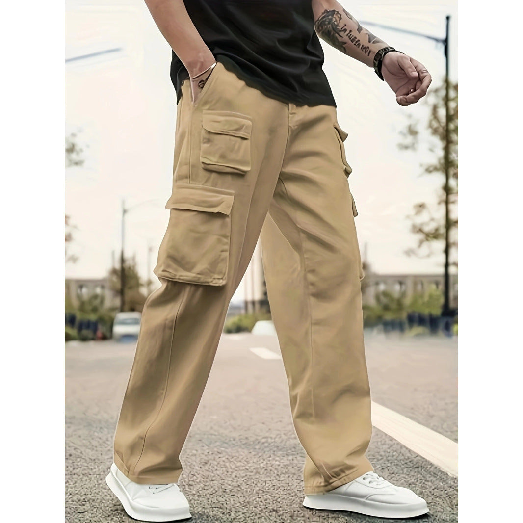 Person wearing beige cargo pants and white sneakers on a blurred street background