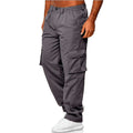 Gray cargo pants worn by a person on a white background