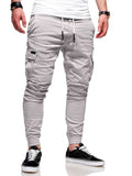 Light gray jogger pants worn by a person on a white background