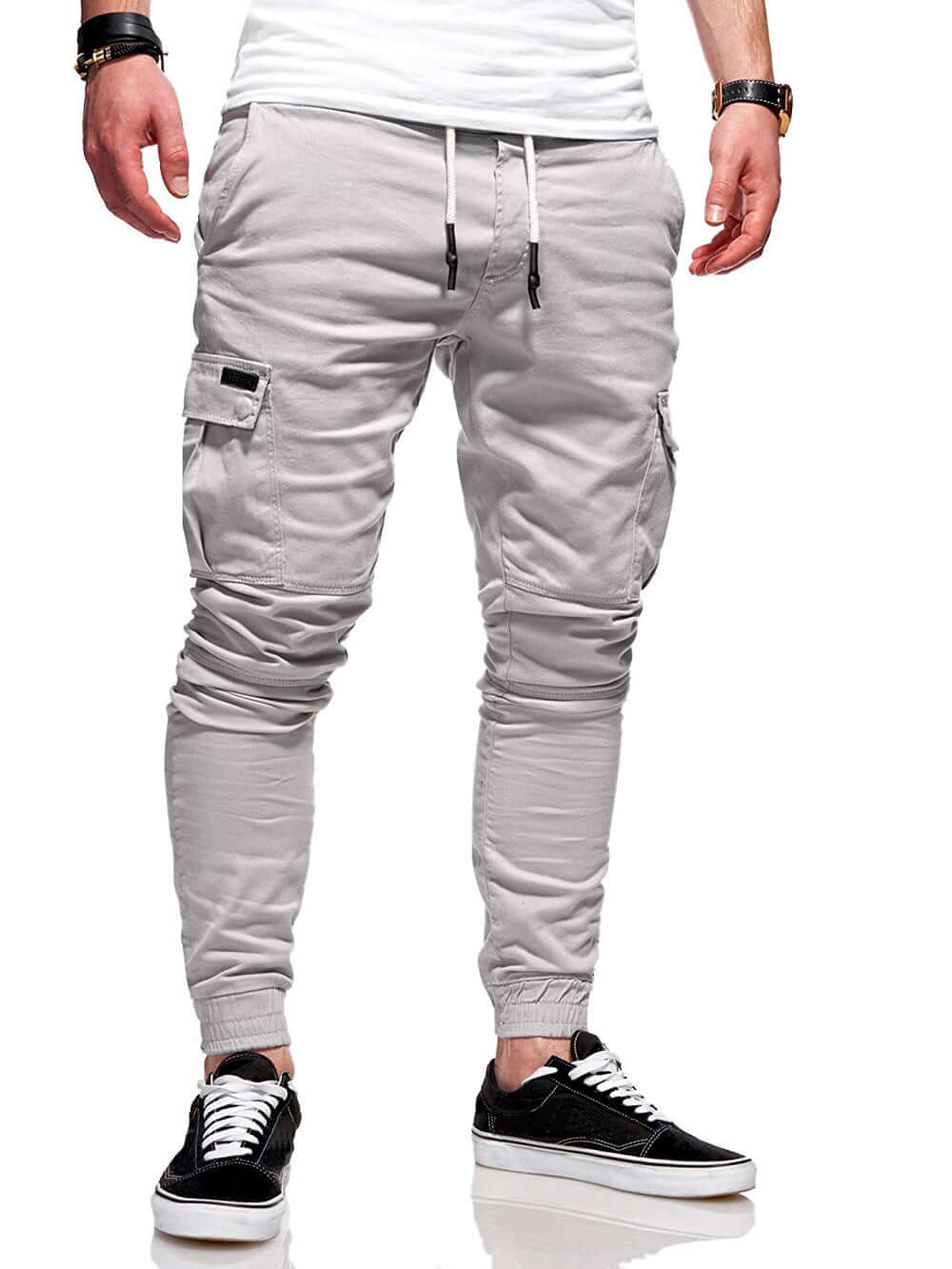 Light gray jogger pants worn by a person on a white background