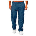Blue cargo pants worn by a person on a white background