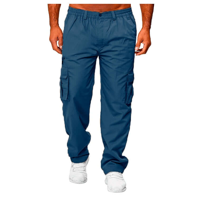 Blue cargo pants worn by a person on a white background